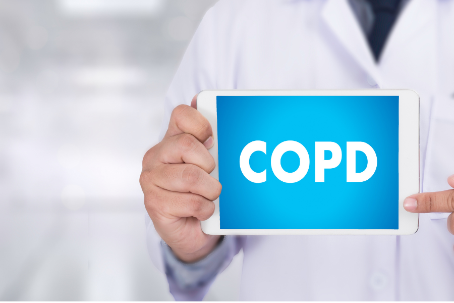 Doctor holding a tablet that says COPD