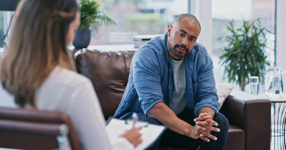 Male patient talking to a therapist